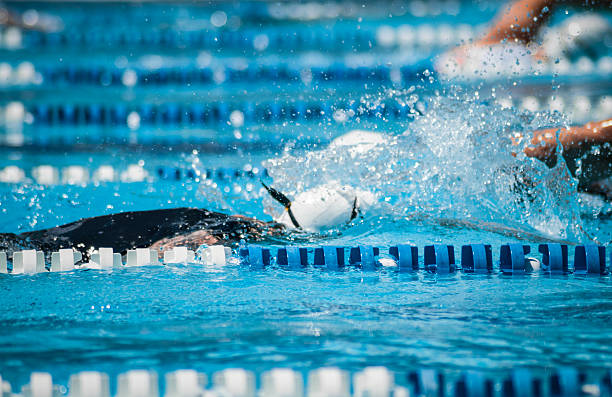 Swim training in a sport pool Detail of a some athlete  swimming in a olympic swimming pool.Other image from the same series: olympic city stock pictures, royalty-free photos & images