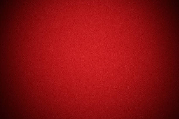 Red fabric texture background with spotlight.Studio shot.
