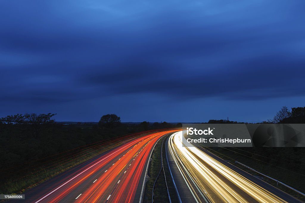 Autopista al atardecer - Foto de stock de Autopista libre de derechos