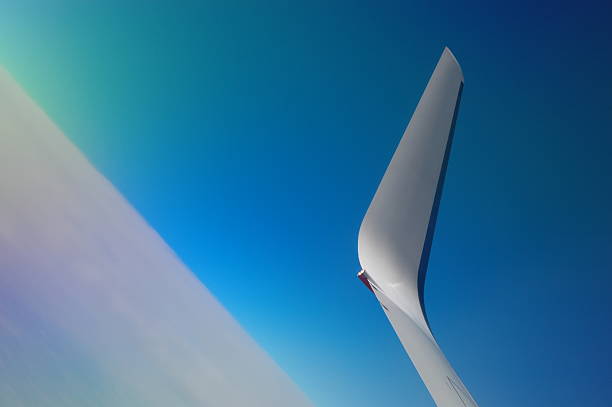 Airplane wingtip in climb stock photo