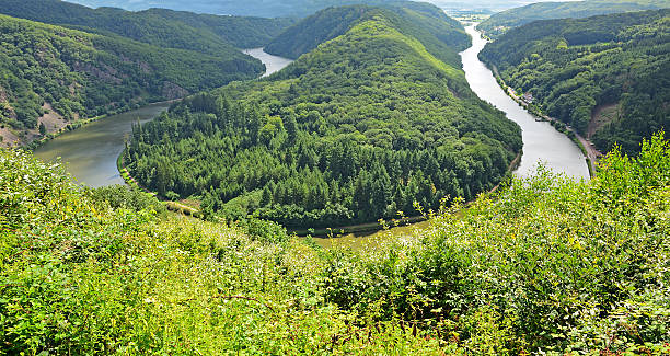istock Curve of river Saar in valley between wooded hills 175600464