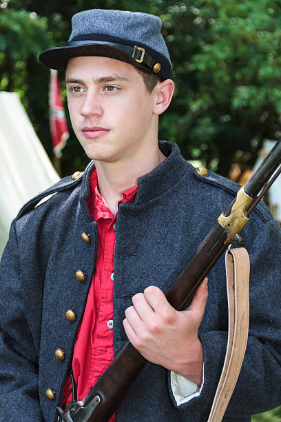 istock Young Confederate Solder Holding a Rifle 175600712