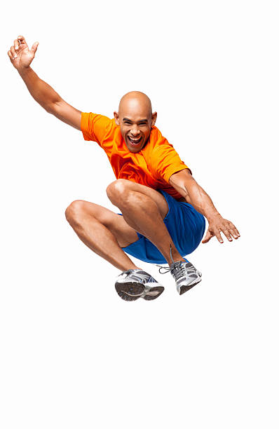 istock Active Male Athlete Jumping In Mid-air - Isolated 175601184