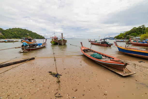 istock Fishing boat docking on the beach 1756015665