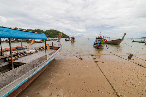 Fishing boat docking on the beach