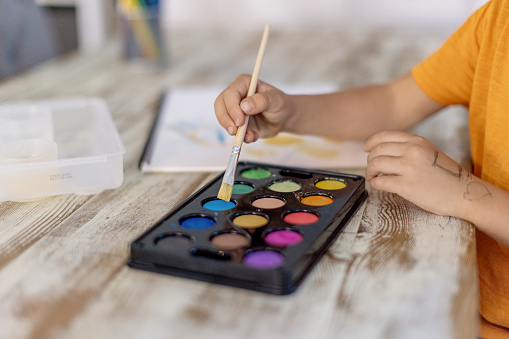 Children draw with paints, the concept of educational activities.