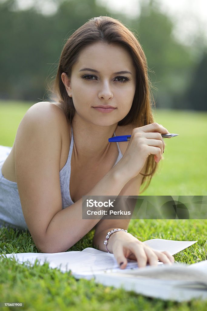 beautiful student with book in park beautiful student with book in park - outdoors shoot Activity Stock Photo