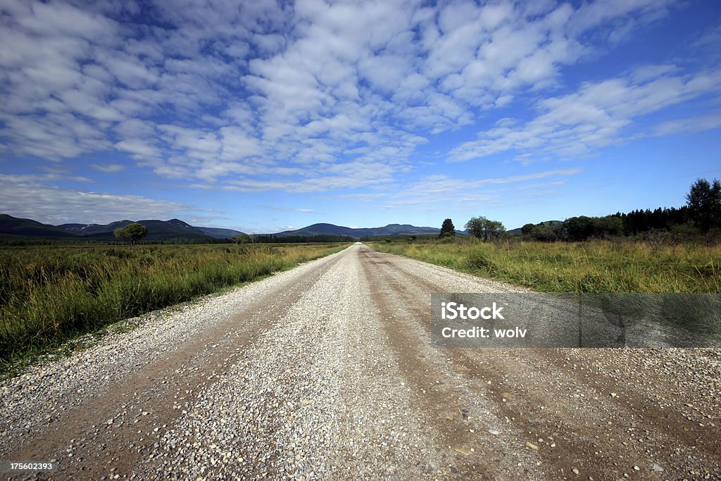 The Long Road (Series-one) Desolate gravel road in the foothills of Alberta. Alberta Stock Photo