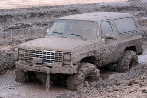 Truck stopped in the mud during a mud bog.Related images: