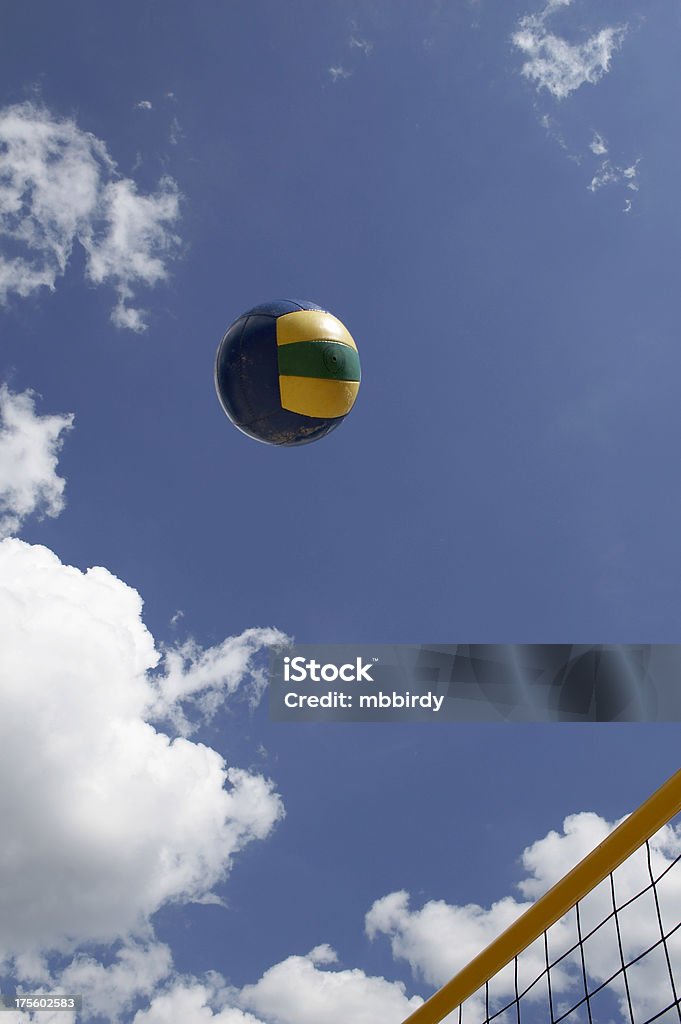 Colorful beach volley net with ball Colorful beach volley net with ball and with blue sky and clouds behind Volleyball - Sport Stock Photo