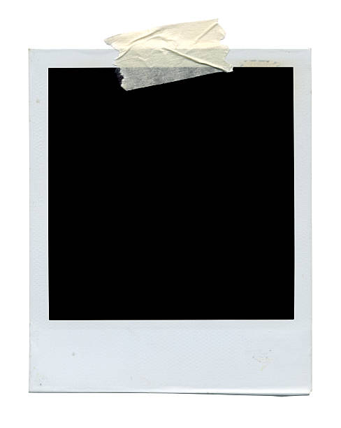 Blank photo on white "A blank photo taped by masking tape, isolated on white background. Clipping path included." polaroid camera stock pictures, royalty-free photos & images