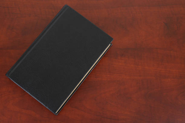 istock Book on wooden table copy space for text. 1756028386