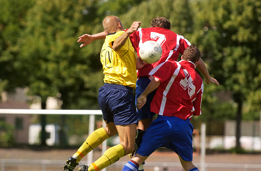 soccer players jumping