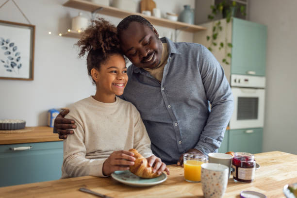 istock Father and daughter having breakfast at home 1756040068