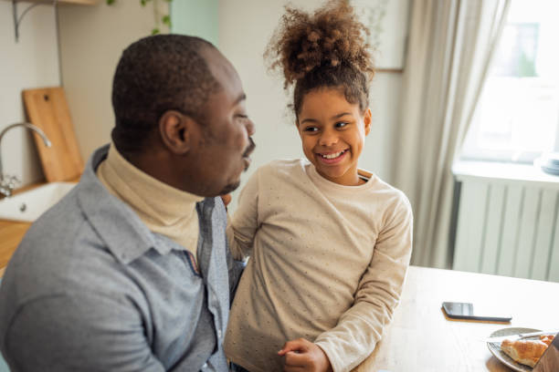 istock Father and daughter having breakfast at home 1756040627