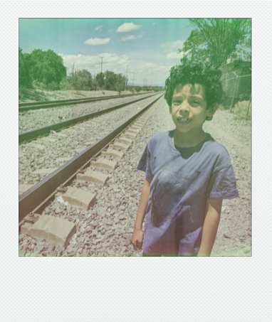 Portrait of a child on the railroad tracks