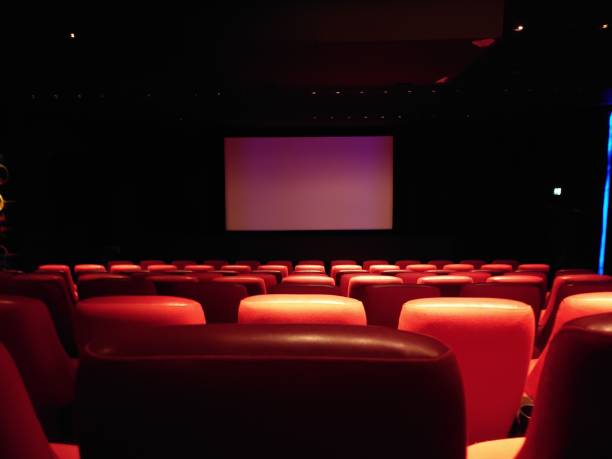 istock the auditorium with red chairs and screen in the dark room 1756058887