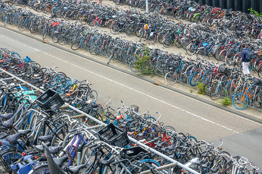 Netherlands, Amsterdam - September 27, 2021: Huge number of bicycles on the big bike parking near Amsterdam Central Station