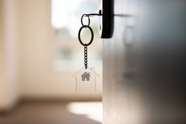 Key chain hanging on a front door stock photo