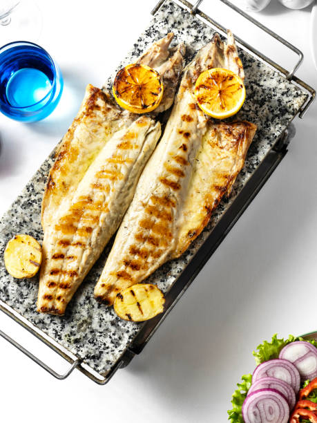 grilled bonito. grilled fish. mackerel. fillet bonito. sea bass. fish dish. fish plate - sea bass prepared fish food grilled imagens e fotografias de stock