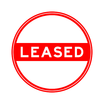 Red color round seal sticker in word leased on white background