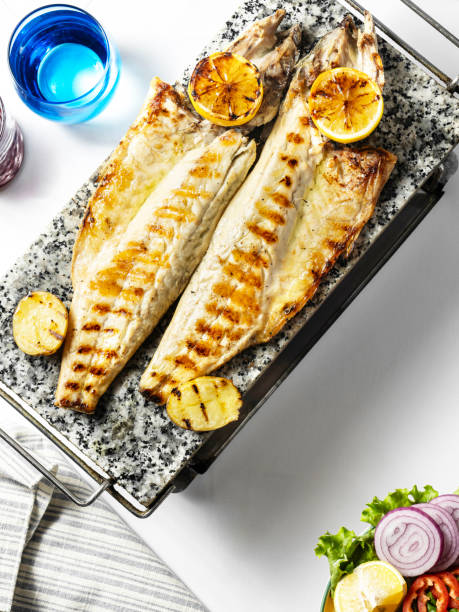 grilled bonito. grilled fish. mackerel. fillet bonito. sea bass. fish dish. fish plate - sea bass prepared fish food grilled imagens e fotografias de stock