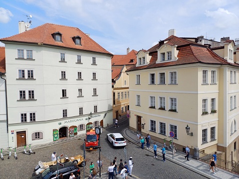 The historical city center and town square of Louny, Czech Republic, with parked cars