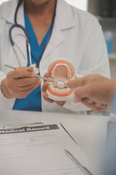 istock Dentists are discussing dental problems at report x-ray image on laptop screen to patients. 1756117997