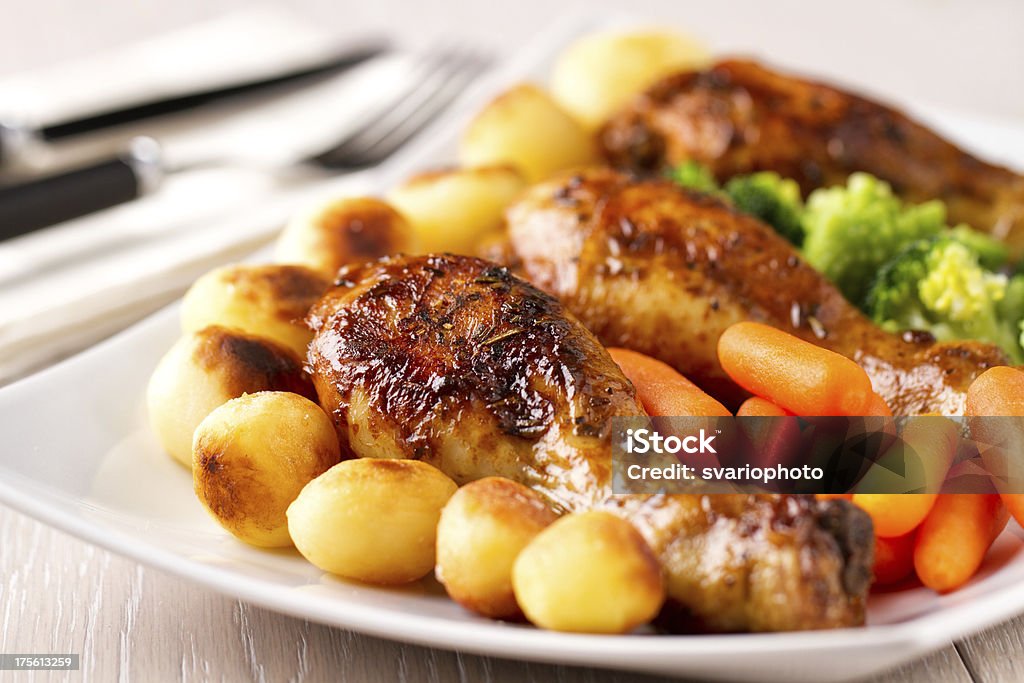 Roast chicken with mixed vegetables Animal Body Part Stock Photo