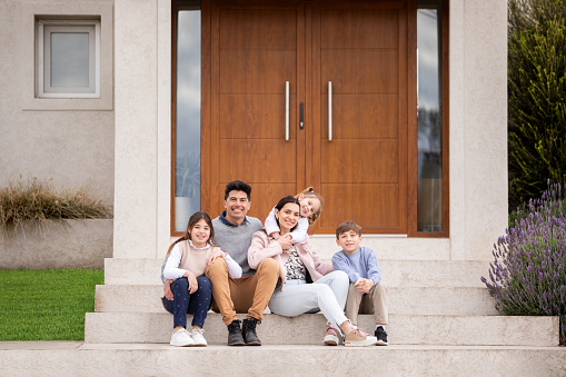 Big happy family at the door of their new house - Buenos Aires - Argentina