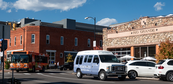 Boulder, Colorado, USA-October 23, 2023:Circulating Hop Bus on Walnut Street in historic downtown Boulder, Colorado.
