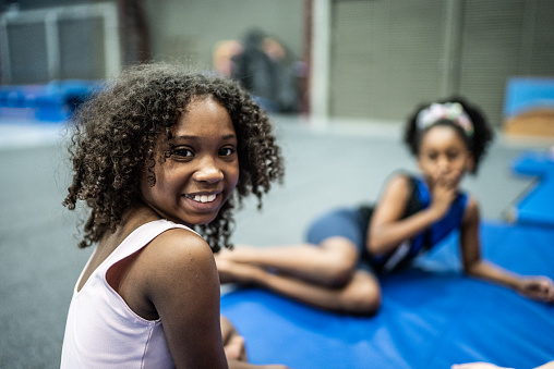 Portrait of a gymnast girl in a gymnasium