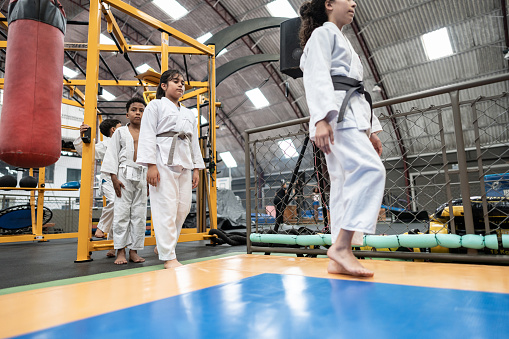 Students entering in a judo class at the gym