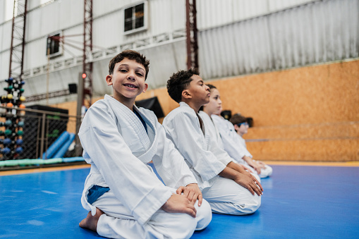 Portrait of a boy in a judo class at the gym