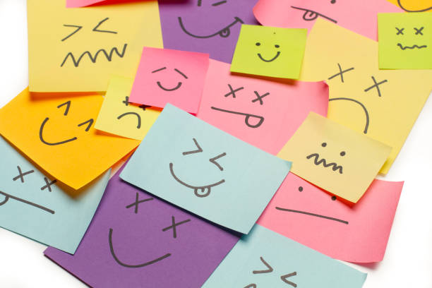 istock Colored paper notes with drawings of different face emotions on a white background 1756172041