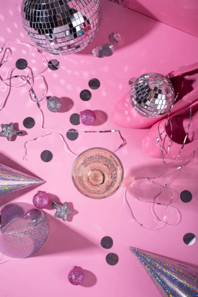 istock Glass of champagne with silver disco ball 1756174338