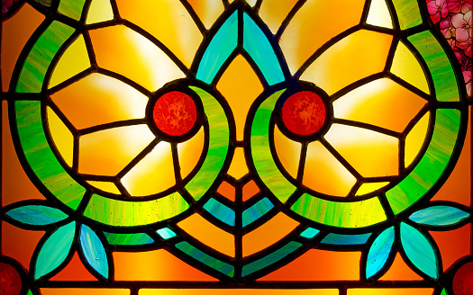 Ornate floral pattern in a stained glass window at the Victoria Legislative Building in Victoria, British Columbia, Canada.(Public building)