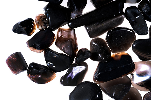 A view of a collection of smooth tumbled pebbles and stones, in a still life setting.