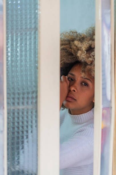 istock afro latin woman is at home with a sad face while she is alone 1756180383