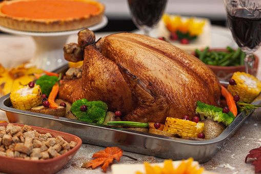 Traditional stuffed Thanksgiving turkey with side dishes