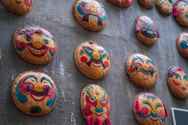 Masks drawing on flat winnowing basket, which knitted from bamboo - Nha Trang city, Khanh Hoa