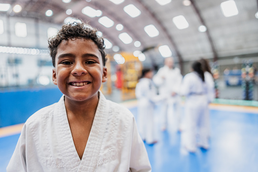 Portrait of a boy in a judo class at the gym