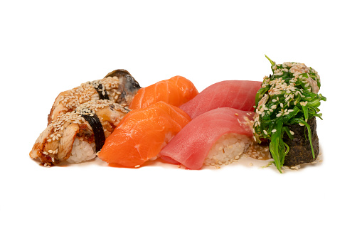 Sushi with salmon, eel, tuna, hiyashi wakame, sesame isolated on a white background.
