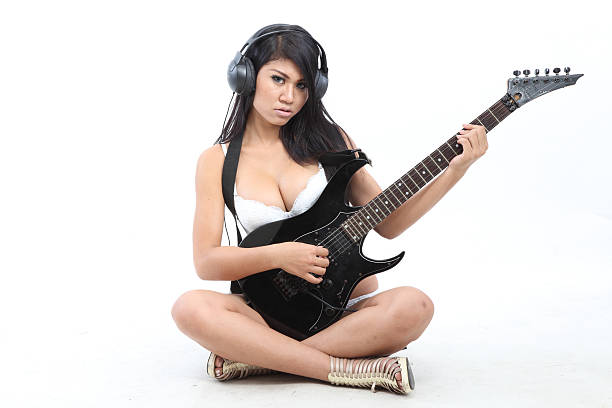 セクシーなアジアの女の子、ギター ストックフォト