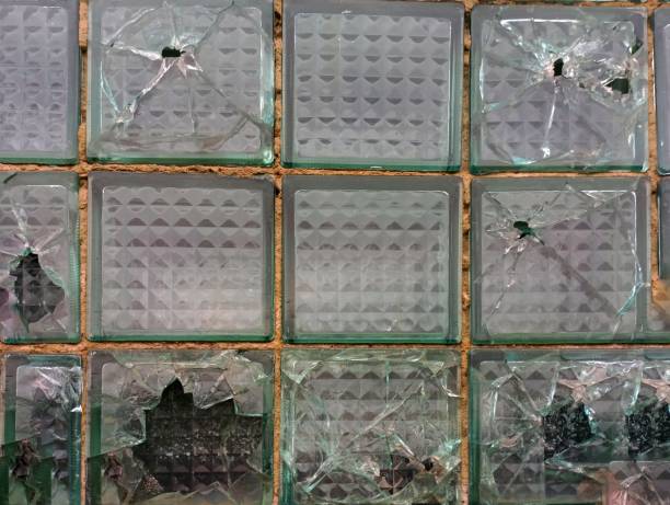 istock Texture. Old broken glass blocks. A wall of glass blocks. 1756213804
