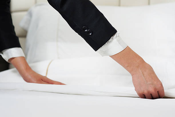 130+ Woman Folding Sheets Stock Photos, Pictures & Royalty-Free Images