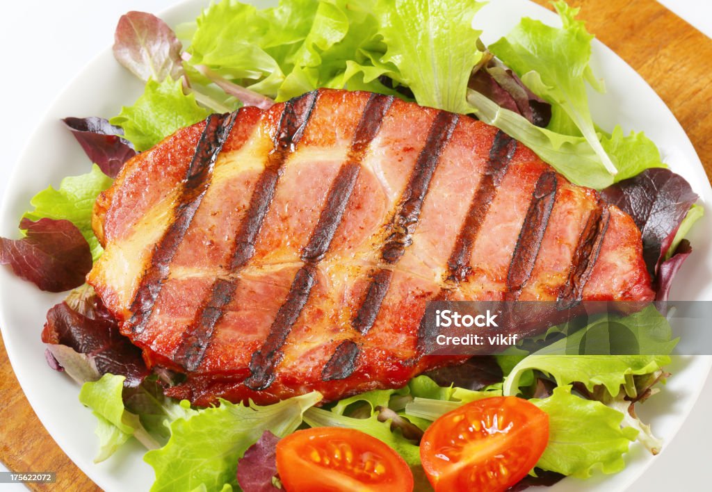 Grilled pork with salad greens Grilled pork neck meat with salad greens Barbecue - Meal Stock Photo