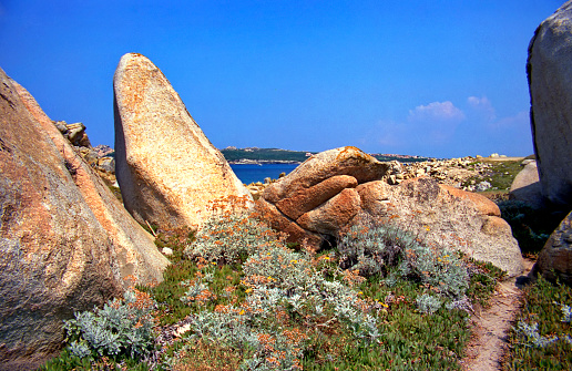 analogue photo of the granite rocks eroded by the wind on the beaches of Gallura in Sardinia