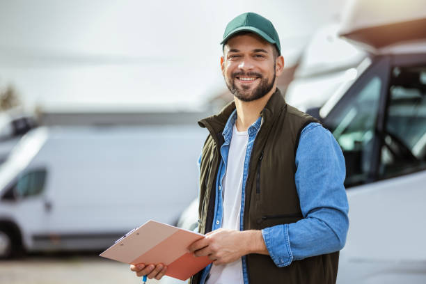 istock Happy confident male driver standing in front on his truck 1756240623