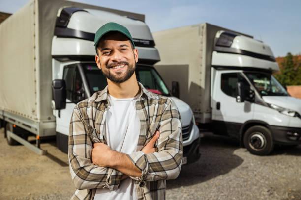 istock Happy confident male driver standing in front on his truck 1756240626